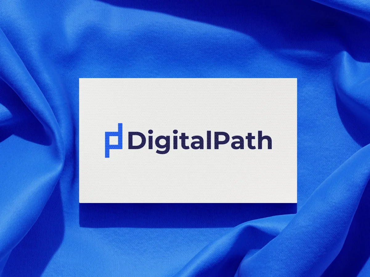 DigitalPath logo on a business card over blue fabric